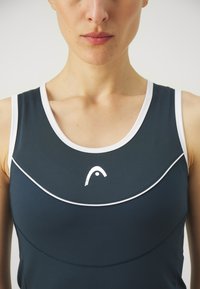 Navy athletic tank top with white trim, featuring a rounded neckline and reflective logo at the center. Smooth texture and fitted design.