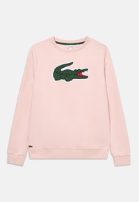 Sudadera rosa con un gran logo de cocodrilo verde y acentos rojos en la parte delantera, y puños y dobladillo acanalados. Material de algodón.