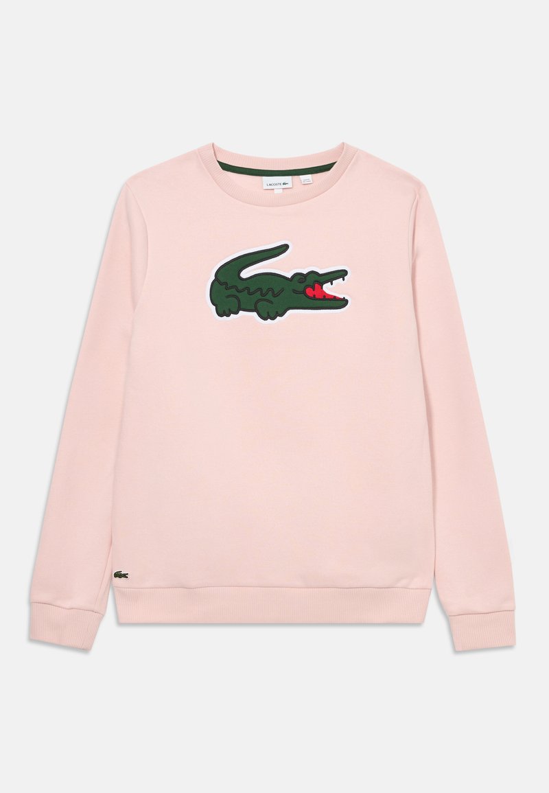 Sudadera rosa con un gran logo de cocodrilo verde y acentos rojos en la parte delantera, y puños y dobladillo acanalados. Material de algodón.