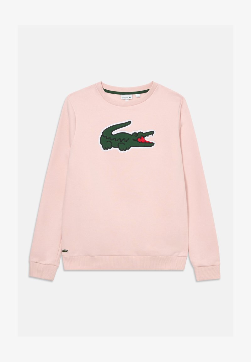 Růžová mikina s velkým zeleným logem aligátora na přední straně a červenými akcenty, s žebrovanými manžetami a spodním lemem. Bavlněný materiál.