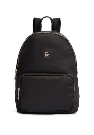 Sac à dos en nylon noir avec poche zippée à l'avant, fermetures éclair dorées, petit logo "H" doré, bretelles rembourrées et poignée supérieure.