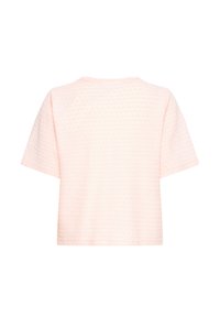 Haut texturé à manches courtes rose pâle avec un motif géométrique subtil, vu de dos avec un col rond.