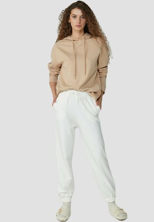 MÜDER - Jogginghose - off-white