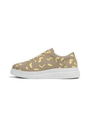 Light brown sneaker with yellow abstract patterns, fabric material, round toe, white rubber sole, and five eyelets for laces.