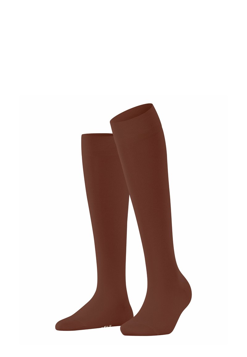 Braune kniehohe Socken aus glattem, dehnbarem Stoff. Sie verfügen über einen nahtlosen oberen Rand mit enganliegendem Sitz und einer einheitlichen, soliden Farbe.