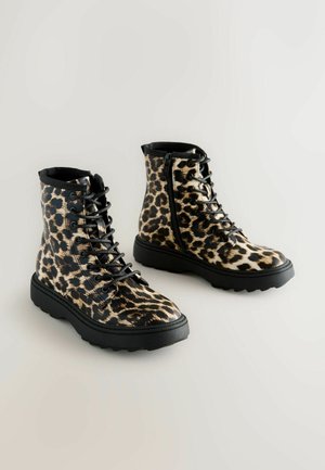 Leopard-print faux leather combat boots with black laces, textured surface, and rubber sole. Features side zipper and sturdy design.