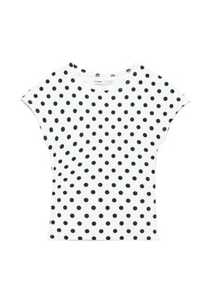 Chemise blanche à manches courtes avec des pois noirs uniformément espacés sur le tissu, col rond et coupe ajustée.