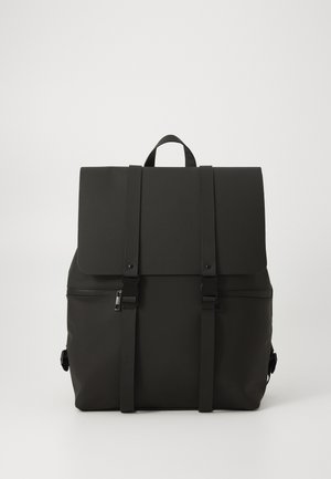 Black backpack made of durable material with a flap closure, two adjustable straps, and front zipper pocket. Minimalist design.