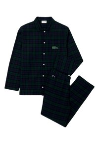 Σετ πιτζάμας με καρό σχέδιο σε σκούρο πράσινο και ναυτικό, που διαθέτει πουκάμισο με κουμπιά και τσέπη στο στήθος, καθώς και παντελόνι με ελαστική μέση σε ταιριαστό σχέδιο, από βαμβακερό υλικό.