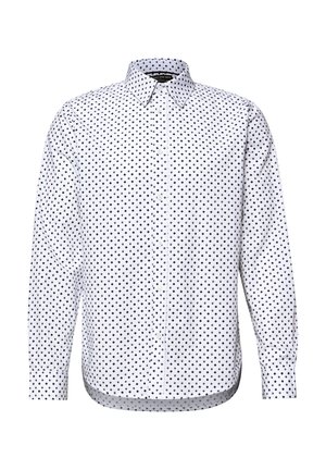 Camicia bianca a maniche lunghe con bottone davanti, decorata da un motivo a diamanti neri, colletto appuntito e polsini, mostrata su uno sfondo bianco uniforme.