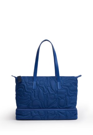 Borsa a spalla trapuntata blu con due manici e una tasca separata con zip nella parte inferiore, mostrata su sfondo bianco.