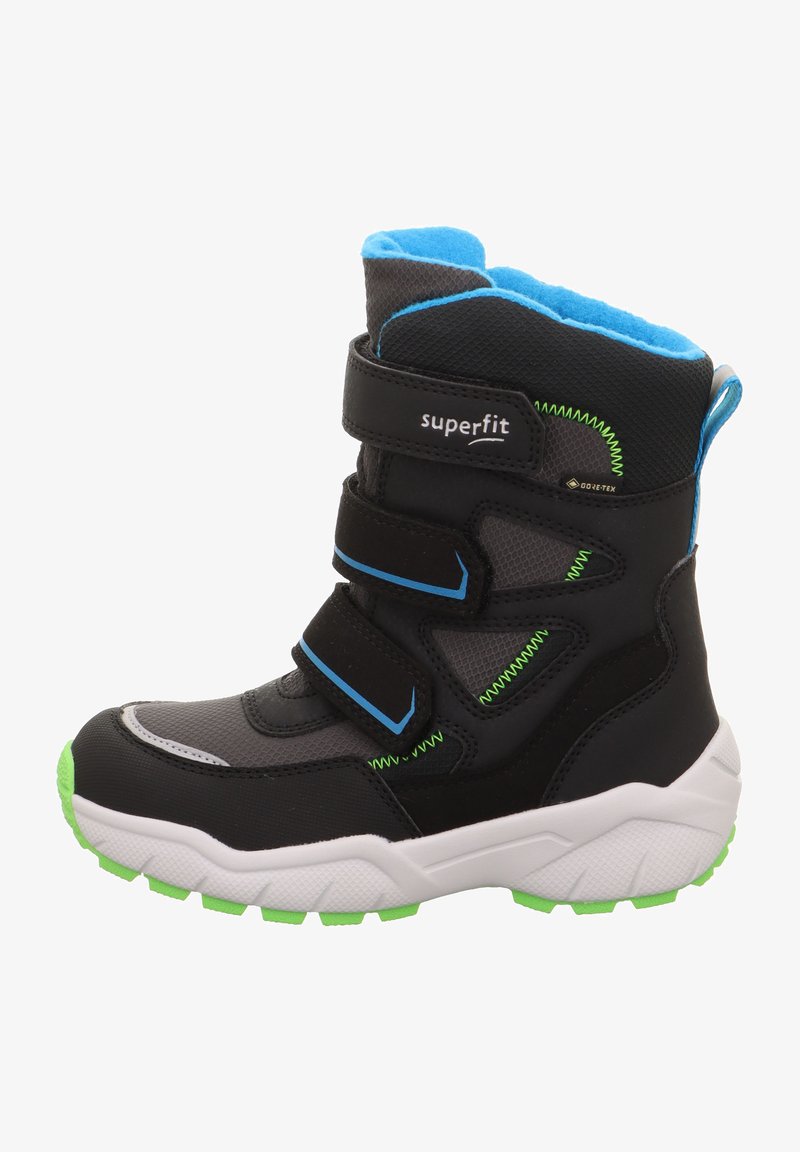 Bottes noires imperméables avec des accents bleus, semelle verte, sangles en Velcro, col rembourré et matériau texturé, conçues pour un usage extérieur avec une forme robuste.