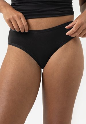 Mutande a vita alta in cotone nero con una finitura liscia e un elastico in vita. Bordature senza cuciture per un comfort ottimale e una vestibilità aderente.