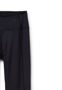 Černé sportovní legíny s vysokým pasem, vyrobené z elastického materiálu. Disponují tónovými švy a malým logem na pasu.