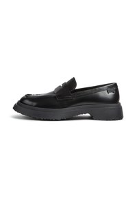 Black leather loafer with a thick rubber sole, penny strap, and rounded toe, shown in side profile on white background.