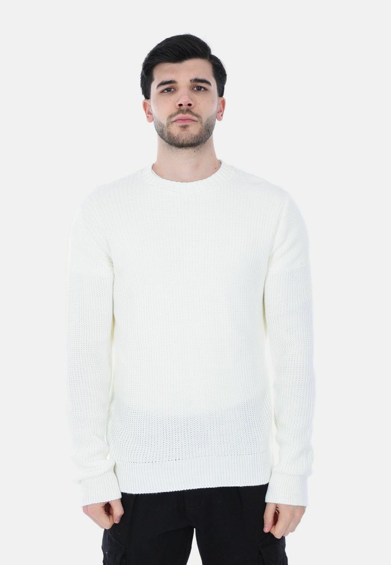 Maglione bianco a trama con scollatura rotonda e maniche lunghe, caratterizzato da polsini e orlo a costine. Realizzato in un morbido materiale lavorato a maglia.