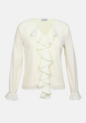 Cream-colored blouse with ruffled V-neckline and long sleeves. Features textured fabric and ruffled cuffs for added detail.