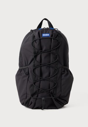 Black backpack made of durable fabric, featuring a front bungee cord design, side pockets, and a top handle for carrying.