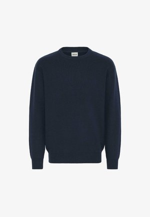 Mørkeblå strikkegenser med rund halslinning, lange ermer og ribbestrikkede mansjetter og hem. Laget av mykt stoff med et strukturert mønster.