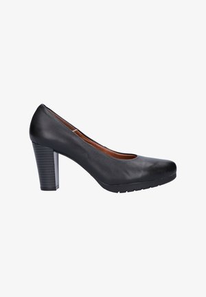 Zapato de tacón alto de cuero negro con puntera redondeada, tacón de bloque texturizado y parte superior suave. La suela presenta un ligero patrón de agarre.
