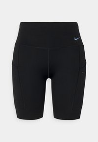 Svarta sportshorts tillverkade av elastiskt material, med hög midja, sidofickor och en liten bl å logotyp på framsidan.