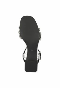 Sandal con tacco alto nero, caratterizzata da una suola testurizzata, cinturini argento e decorazioni vicino alla caviglia, taglia contrassegnata 37.