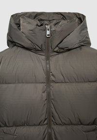 Dark gray puffer jacket with a high collar, front zipper, and quilted texture. Smooth material with a minimalist design and no visible logos.