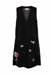 Chaleco negro con escote en V, dos bolsillos delanteros y detalles de bordado colorido de flores y estrellas. El interior presenta un patrón de lunares.