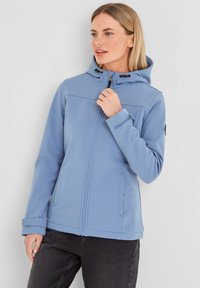 Light blue softshell jacket with a hood, zip closure, adjustable drawstring, and side pockets. Durable material with a smooth texture.