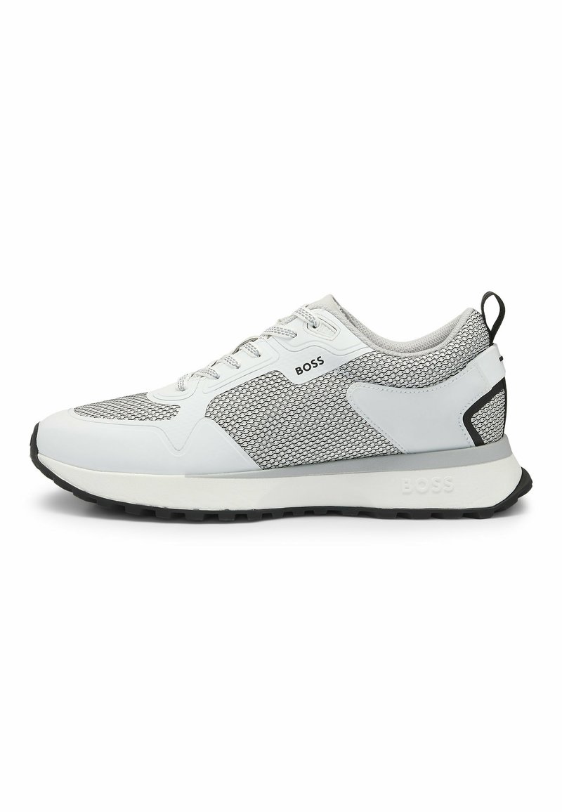 White and grey athletic shoe featuring mesh upper, rubber sole, and contrasting black accents. Laces and branding visible on the side.