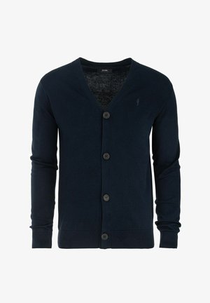 Granatowy kardigan wykonany z miękkiego materiału, z dekoltem w kształcie litery V, pięcioma guzikami, długimi rękawami oraz prążkowanymi mankietami i dołem. Prosty detal z logo.