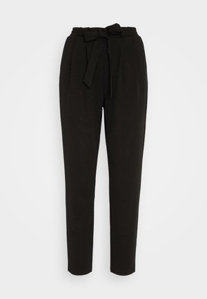 Pantalones negros de tejido trenzado con una cintura alta, detalle de lazo ajustable, piernas entalladas y una textura suave. Adecuados para diversas ocasiones.