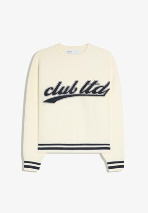 Cream sweater with "club ltd" script in black, ribbed cuffs and hem with navy and white stripes, crewneck collar.