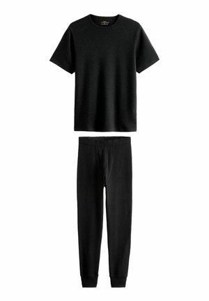 Black ribbed short-sleeve t-shirt and matching black slim-fit pants. Both made from soft fabric, featuring a smooth texture and fitted design.