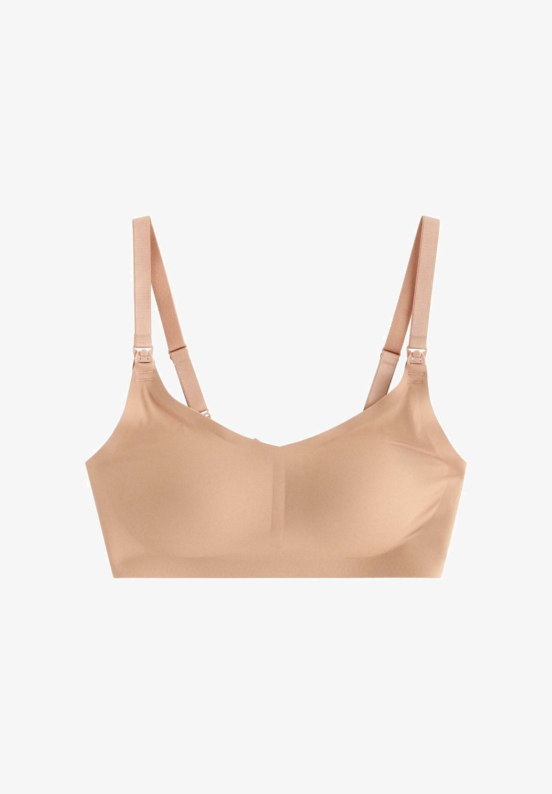 Soutien-gorge sans fil beige avec un tissu lisse, des bretelles réglables et des coutures discrètes. Doté d'un décolleté arrondi et d'une construction sans couture pour le confort.
