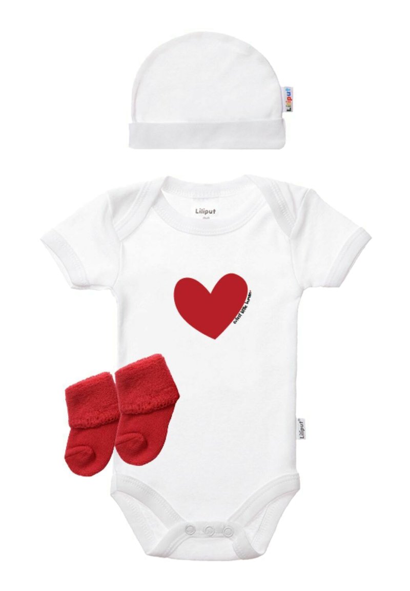 White baby onesie with short sleeves, red heart graphic, accompanied by red fleece booties and a matching white cap. Soft cotton material.