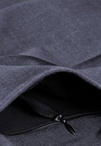 Dark gray fabric with a textured surface and a zippered pocket. The zipper is black, providing contrast against the fabric.