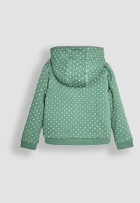 Zelená mikina s bodkami vyrobená z mäkkého materiálu. Má kapucňu, dlhé rukávy a rebrované manžety a spodný lem. Biele bodky pokrývajú celý povrch.
