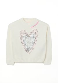 White knitted sweater featuring a heart design made of holes in shades of pink and blue, with "LOVE THERAPY" stitched in pink at the collar.