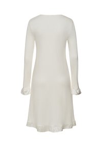 Camicetta da notte a maniche lunghe, colore crema, in tessuto morbido, con scollatura rotonda e polsini e orlo in raso, caratterizzata da un design semplice e liscio.