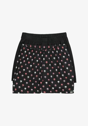 Dos pares de pantalones cortos con cintura elástica negra, uno negro sólido y otro con estampados de palmeras en rosa y blanco.