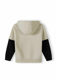 Hoodie i beige med svarta ärmar. Tillverkad av mjukt tyg, den har ribbade muddarna och bandet i nederkant. Enkelt design.
