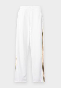 White athletic pants with an elastic waistband, featuring vertical stripes in green, brown, and orange along the sides. Soft texture.