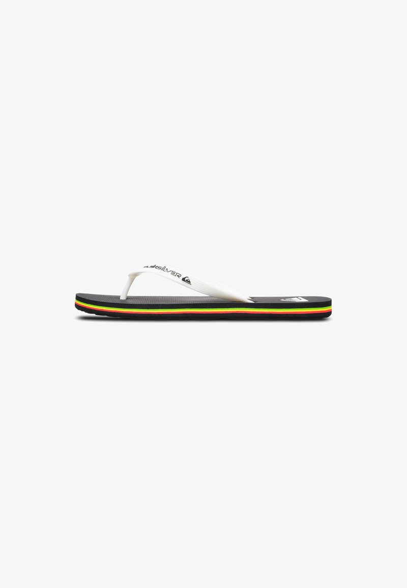 Black flip-flop with white rubber straps, featuring a textured footbed and a multicolored striped sole in red, green, and yellow accents.