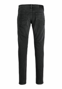 Μαύρο τζιν denim με στενή γραμμή στα πόδια, δύο πίσω τσέπες με ραφές και ζώνη με θηλιές για ζώνη.