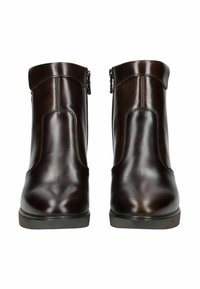 Bottines en cuir marron avec une finition lisse, fermetures éclair sur les côtés et un bout arrondi. Accentuées par des coutures le long des coutures et une semelle basse.