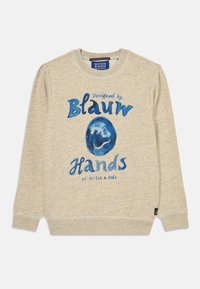 Béžová mikina s dlhými rukávmi, na prednej strane so modrým grafickým textom "Navrhnuté Blauw Hands" a okrúhlym modrým motívom.