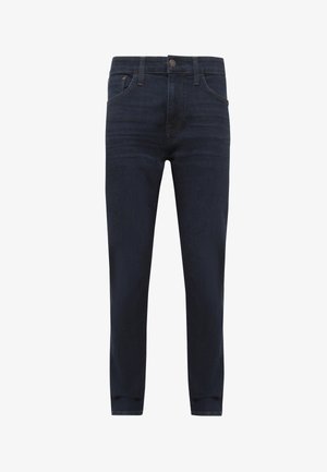 Dark blue denim jeans with a slim fit, five-pocket design, and a button closure. Features subtle stitching and a straight leg cut.