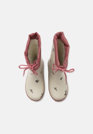 Stivaletti da pioggia beige chiaro alla caviglia con rifiniture rosa, lacci rosa e piccoli motivi a ramo d'ulivo, foderati con morbido pile bianco all'interno.