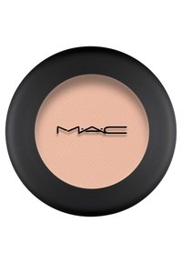 Ronde MAC oogschaduwpan met een matte, zachte perzikkleur. De verpakking heeft een zwarte buitenkant en een doorzichtig binnenlipje.